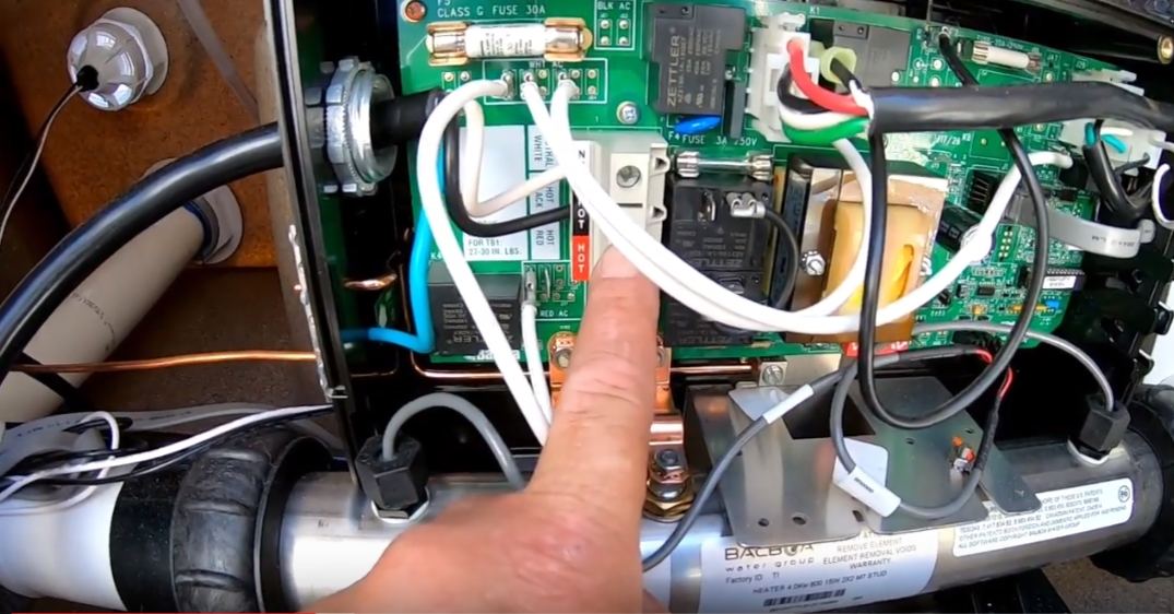 Inside a hot tub control pack during troubleshooting