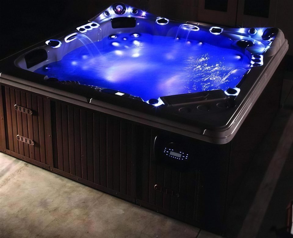 Hot tub glowing blue at night